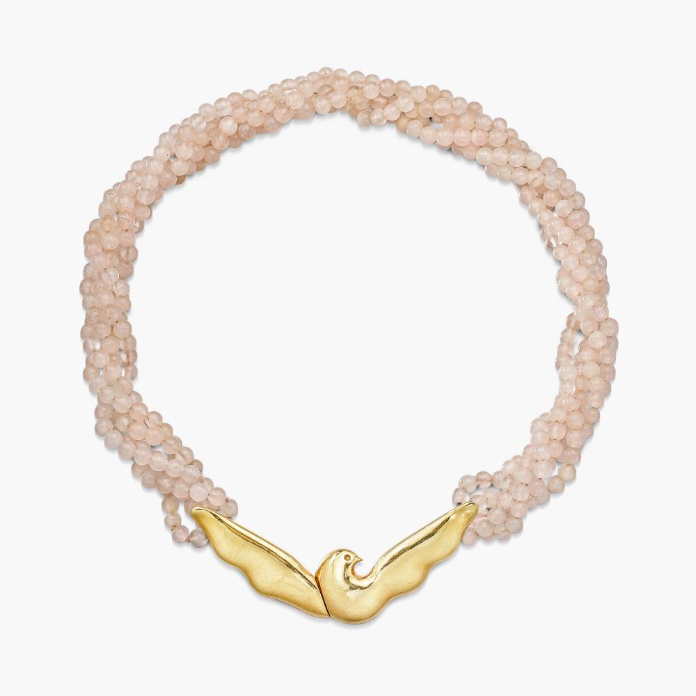 Paloma Picasso for Tiffany & Co.

The front panel designed as a dove, completed by five strands of rose quartz beads.