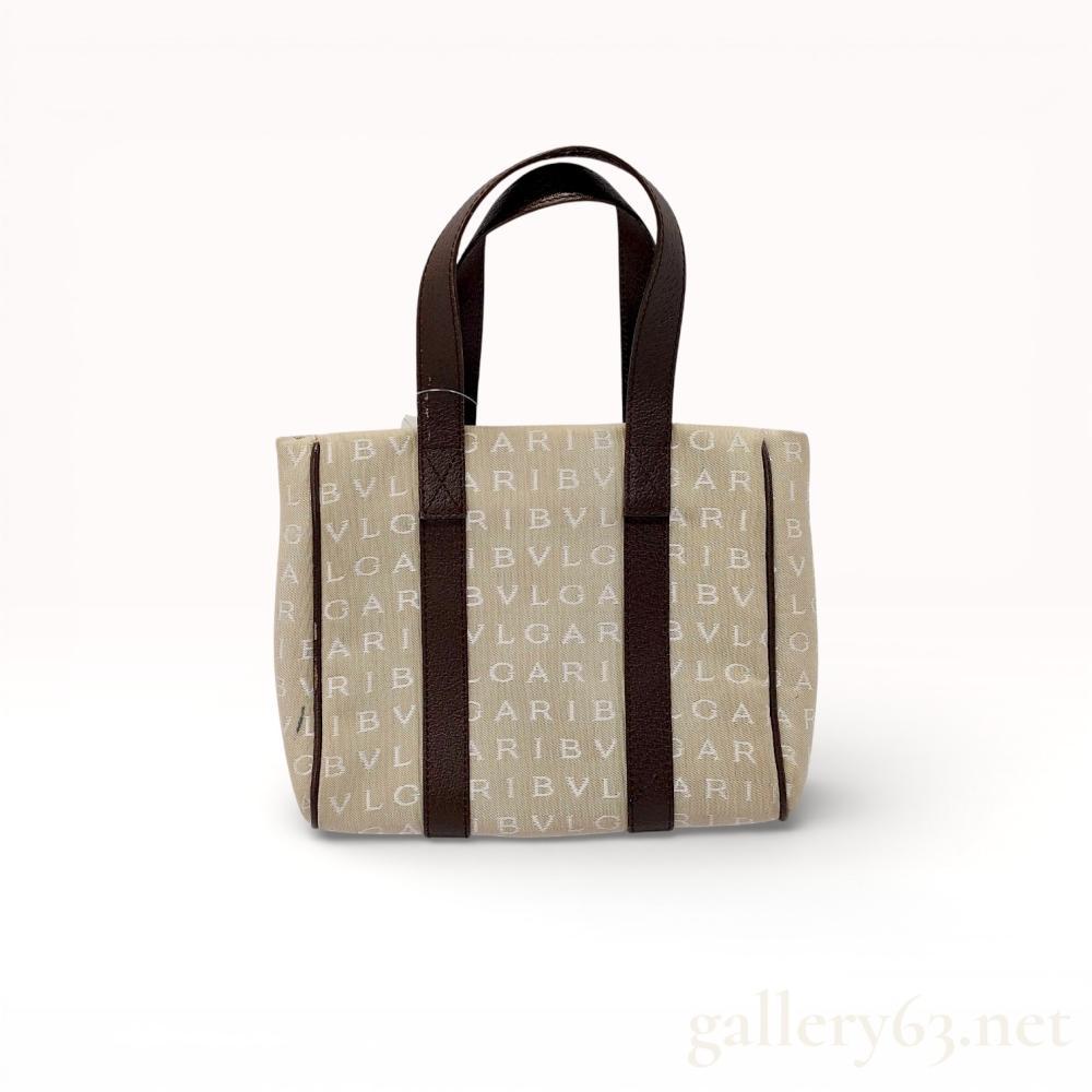 Description
Authentic Bvlgari Logo Mania tote bag in beige canvas and brown leather.