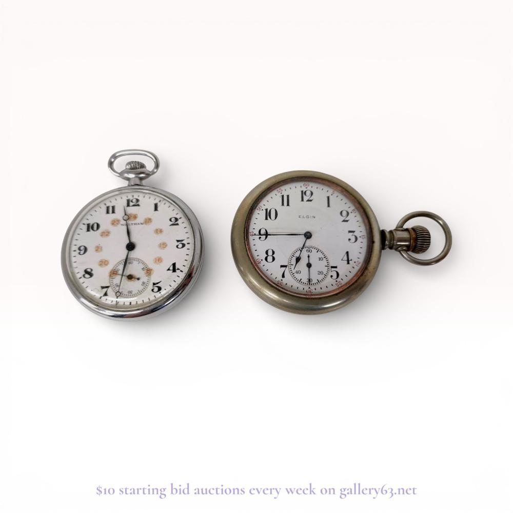 Description
This lot consists of two open-face pocket watches manufactured by Waltham and Elgin. The Waltham watch features a polished white metal case and a white dial with black Arabic numerals and a subsidiary seconds dial at the six o’clock position. The Elgin watch features a matte white metal case with a white dial displaying black Arabic hour numerals, red five-minute interval markers, and a subsidiary seconds dial. Both watches are equipped with manual wind movements and represent classic early 20th-century American horology.
Waltham case diameter: 45mm
Elgin case diameter: 54mm.