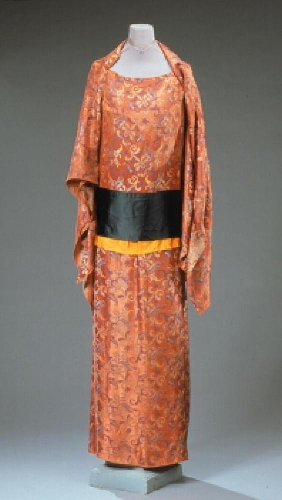 Callot Soeurs Orientalist Gown

Lot 511
Callot Soeurs Orientalist Gown
 French, 1920s 
 Possibly a costume, Japanese inspired russet abstract floral brocade with attached capelet and panels, with an obi inspired sash, size 8-10, labeled: Callot Soeurs/Paris/Nouvelle Marque Deposee. 
Good condition, minor fabric splitting, interior lining damaged.