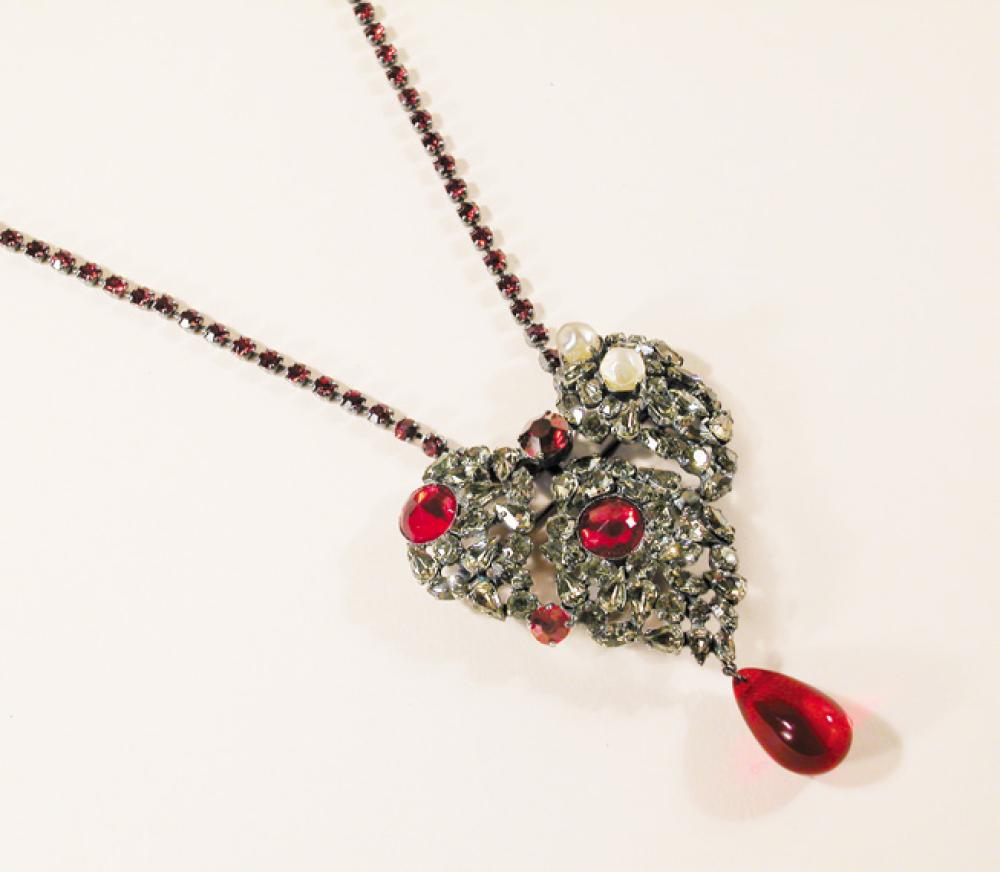 Yves Saint Laurent Heart Brooch Necklace

Lot 938
Yves Saint Laurent Heart Brooch Necklace
 Bejeweled heart pin of faux diamonds, rubies and pearls with ruby rhinestone chain, length 11 inches, signed: Yves Saint Laurent/rive gauche.
 This is the famous necklace that was historically always worn by the bride in the finale of his haute couture collection.