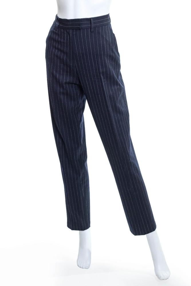 Description
Piazza Sempione per Browns London.

A pair of navy pinstripe straight-leg trousers with side-seamed pockets and button closure, 96% pure new wool, 4% lycra, and further with 85% rayon and 15% lycra, of Italian size 42 (approx. UK size 10)

Grade B

Provenance: The Casandra Collection