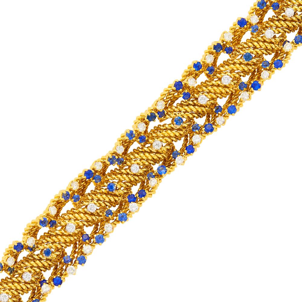 The Estate of the Albert Anna Loeb Family of Chicago Charlevoix, Michigan18 kt., 56 round diamonds ap. 4.50 cts., 91 round sapphires ap. 6.25 cts., ap. 76.8 dwts. Length 6 1/4 inches.

Diamonds: H-I-J-VS.Sapphires: medium to medium deep blue, slightly to moderately included, lively.Width 3/4 inch.                            
Any condition statement is given as a courtesy to a client, is an opinion and should not be treated as a statement of fact and our Organization shall have no responsibility for any error or omission. Please contact the specialist department to request further information or additional images that may be available.