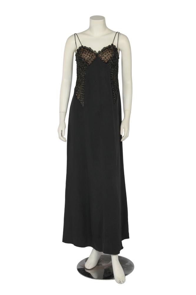 A Valentino Garavani beaded black crêpe evening gown, Autumn-Winter 1998-99

A Valentino Garavani beaded black crêpe evening gown, Autumn-Winter 1998-99

Boutique label, size 37, with black tulle breast cups and side panels embroidered with a lattice of black beads, with sweetheart neckline, slender satin double straps, bust 81cm 32in

Share this lot: