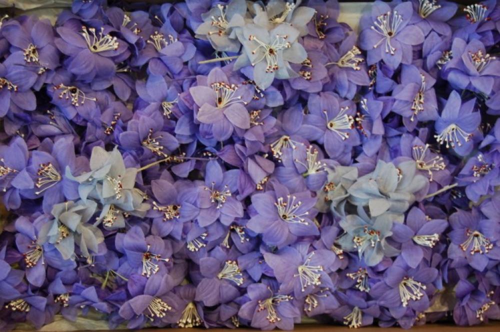 

Five boxes of silk flowers sprays and posies, comprising: one of large and small white flowers (15); one of white, pink and violet sprays (60); one of lilac flowers (110); one of blue and pink apple blossom (45); and another of small yellow flowers in bunches (35)
