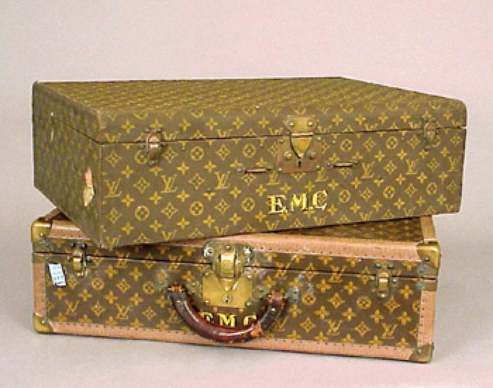 Two Louis Vuitton Suitcases

Lot 1241
Two Louis Vuitton Suitcases
 Each monogram canvas with yellow monogram EMC, one LV stamped leather trim and brass corners and locks, lock no. 112112 the next monogram canvas with rounded top edge, brass locks, each labeled : Louis Vuitton/Made In France. Height of each 16 1/2 inches, width 23 1/2 inches, depth 7 inches.
The first good condition, some losses to canvas, the next good condition, handle missing.