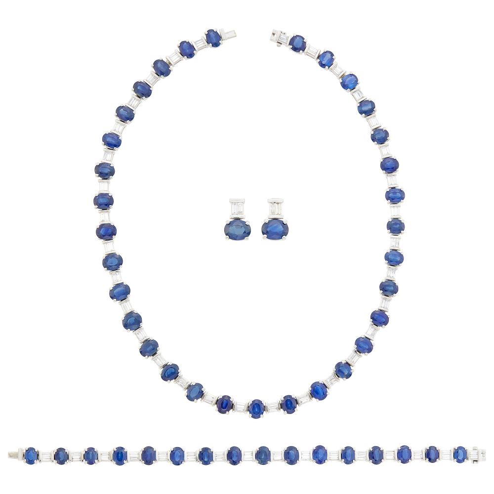 From a Malibu Collector50 oval sapphire ap. 64.85 cts., 100 baguette and tapered baguette diamonds ap. 8.30 cts., ap. 80 dwts. Lengths 16 1/4 and 7 inches.
 
With GIA report no. 6237870600, one sapphire tested, stating No Indications of Heating.

Sapphires: medium deep blue, cleanish to slightly included, minor banding, some haziness, lively.Diamonds: G-H-I-VS.Necklace and bracelet width 5/16 inch.Posts. 1/2 x 1/4 inch.Necklace: 32 sapphires ap. 44.80 cts.Bracelet: 16 sapphires ap. 17.45 cts.Earrings: 2 sapphires ap. 2.60 cts.                            
Any condition statement is given as a courtesy to a client, is an opinion and should not be treated as a statement of fact and our Organization shall have no responsibility for any error or omission. Please contact the specialist department to request further information or additional images that may be available.