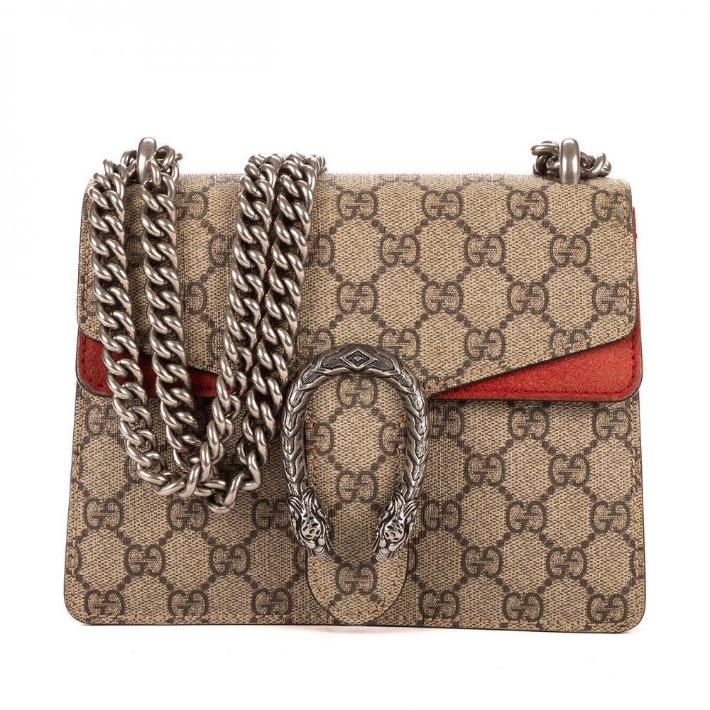Description

GUCCI
Dionysus (Mini) bag.
GG Supreme coated canvas in shades of beige and ebony, with russet suede accents on the flap. Features the iconic antiqued silver-tone tiger head clasp, characteristic of the Dio collection. Magnetic closure and compact interior compartment. Silver chain top handle and red lined interior.
With interior numbering.
In excellent condition, slight signs of use.
Measurements: 20 x 15,5 x 5 cm.
Despite the novelty of its design, the Dionysus bag by Gucci predicts to become a classic of the firm. It is a versatile, colorful and distinguished bag, conceived by Alessandro Michele, which comes in different sizes (hand or shoulder). It is a high quality bag, with a sliding chain that allows you to vary its length and a pin closure, with side hook, topped by a spur with textured tiger head.

With interior numbering. In excellent condition, slight signs of use.