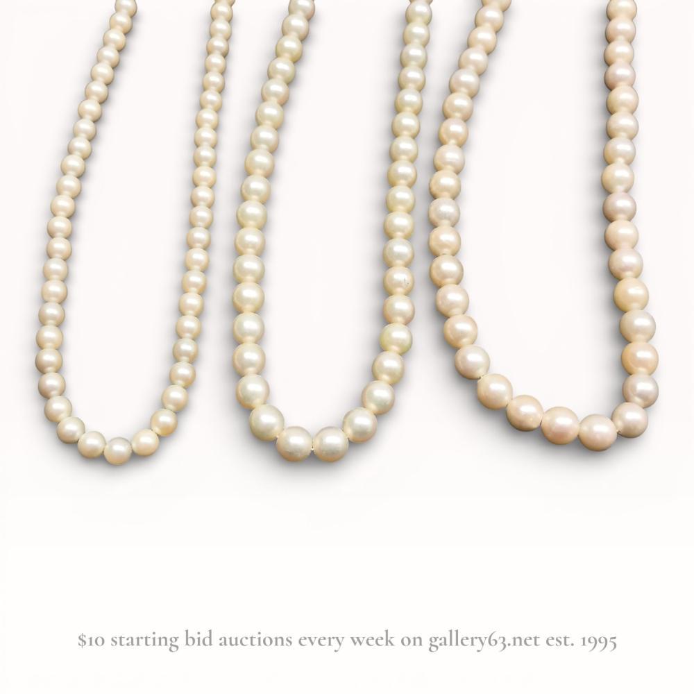 Description
A trio of single-strand necklaces featuring cream-colored beads, including one graduated strand and two uniform strands. Each necklace is secured with a filigree clasp stamped SILVER, comprising one circular box clasp and two marquise-shaped fishhook clasps. The beads are professionally strung on cord with visible knots or spacers between each bead.
