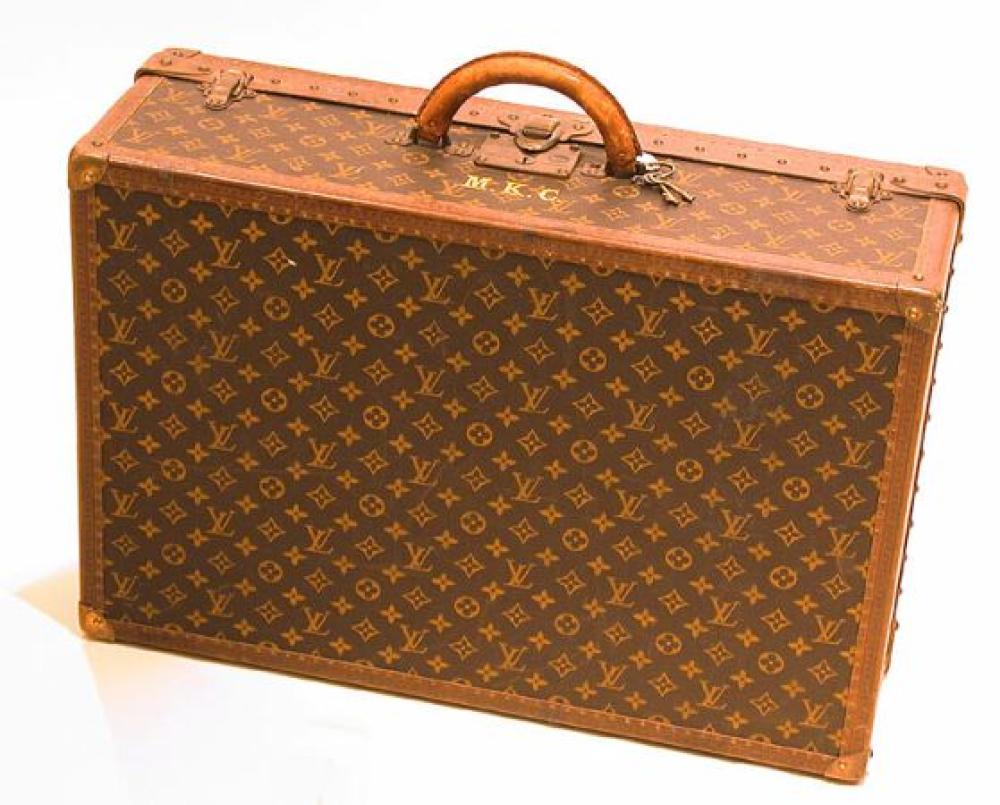 Louis Vuitton Suitcase

Lot 1001
Louis Vuitton Suitcase
 1950s 
 Monogram canvas, LV stamped leather trim, brass corners, leather handle, lock no. 116096 with keys, canvas interior with tray, 17 x 26 x 8 1/2 inches, interior paper labels: Louis Vuitton/Av. Marceu /Paris/Nice/2 Av. De Suede/no.872454 and Bought From Saks & Co./ Fifth Avenue/New York. 
 Good condition, general use and wear, minor interior marks.