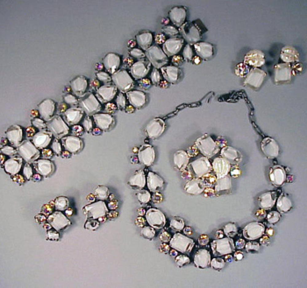 Schiaparelli White Stone Suite 1950s

Lot 481
Schiaparelli White Stone Suite 1950s
 1950s 
 Clear stones with white interior with iridescent rhinestones, bracelet, necklace, brooch and two pairs earrings, marked