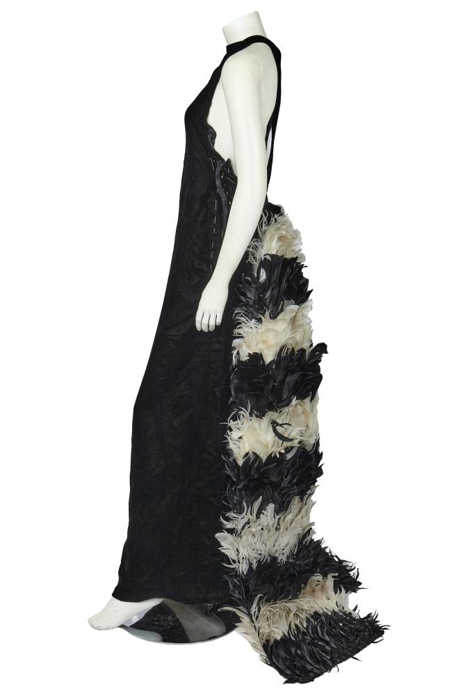 An unfinished André Courrèges haute couture black velvet and feather evening gown, 1960s

An unfinished André Courrèges haute couture black velvet and feather evening gown, 1960s

Prototypes label and numbered 1351, the incomplete gown with high neckline, the open back with crossover straps, the trained floating panel covered in stripes of black and white feathers, lined in black silk, waist approx 71cm 28in; together with extra feather trims (2)

Share this lot: