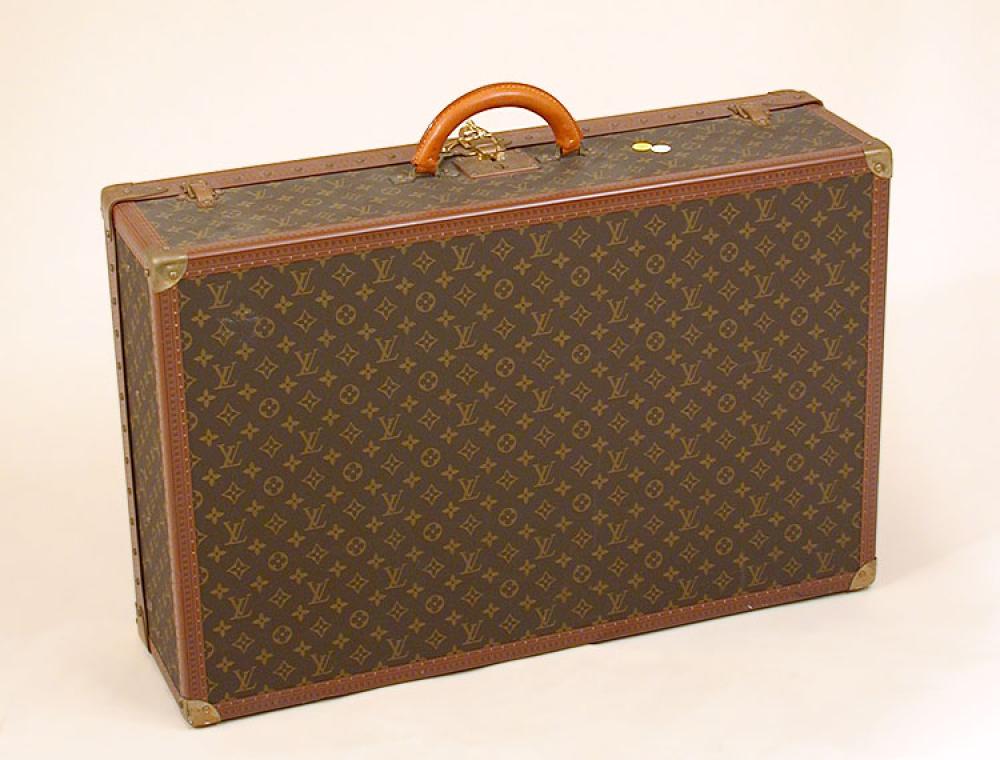 Louis Vuitton Suitcase

Lot 1004
Louis Vuitton Suitcase
 Monogram canvas, LV stamped leather trim, brass locks and corners, lock no. 179714, replaced rolled leather handle, canvas interior and tray with natural linen base and straps, with keys, 19 1/2 x 29 1/2 x 9 inches, interior label: Louis Vuitton/AV Marceau 78 Paris/Nice 2 Av du Suede, no. 986049. 
Excellent condition.