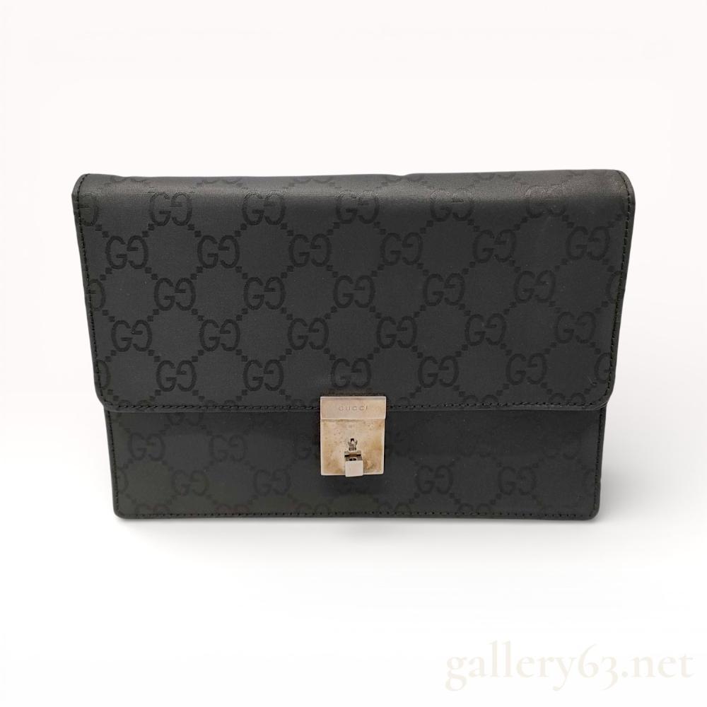 Description
Authentic Gucci leather bag featuring an allover GG Imprime pattern in black. Design having a structured rectangular silhouette with a fold-over flap and a polished metal push-lock closure at the front. Bag fitted with a compact interior suitable for essentials, reflecting minimalist Gucci styling with subtle logo detailing.