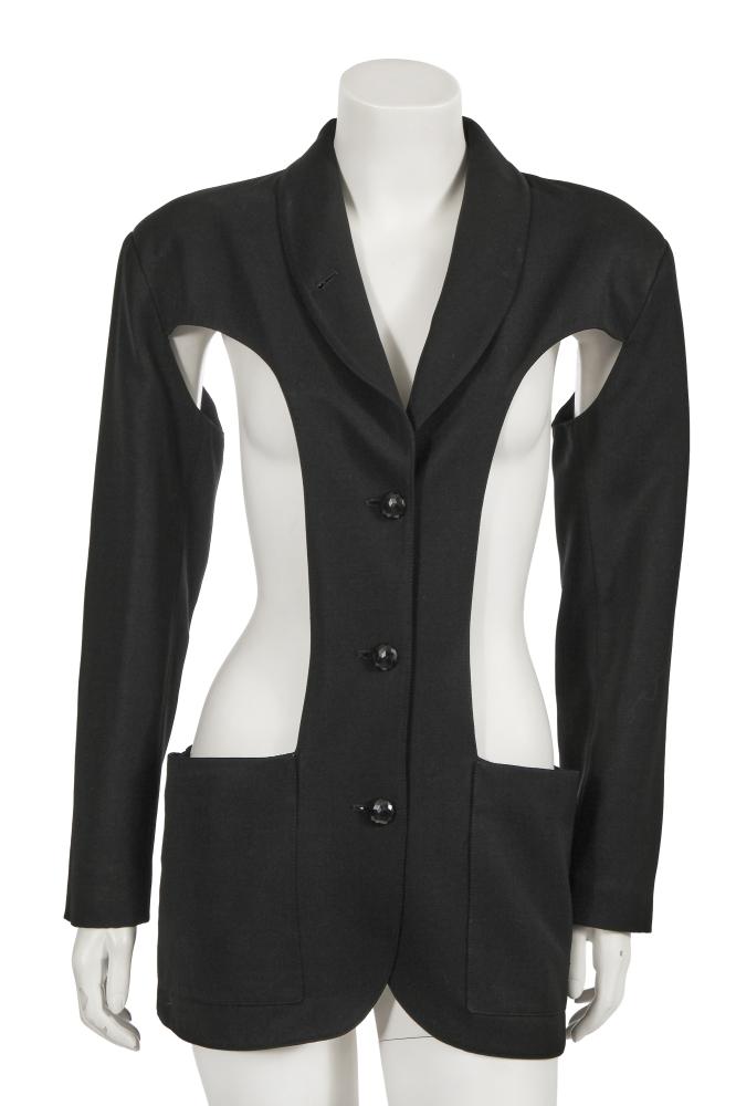A Jean Paul Gaultier black cut-out jacket, ‘Une garde-robe pour deux’ collection, Spring-Summer 1985

A Jean Paul Gaultier black cut-out jacket, ‘Une garde-robe pour deux’ collection, Spring-Summer 1985

Gibo labelled, size 42, with two large curved cut-outs to the body of the jacket, patch pockets to each hip, three faceted black plastic buttons, quilted black satin lining, bust approx 81cm 32in

Share this lot: