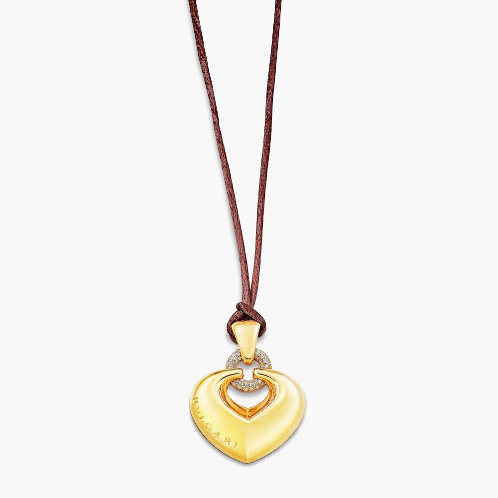 Bulgari

Suspending a puffed heart-shaped motif, decorated with brilliant-cut diamonds.
