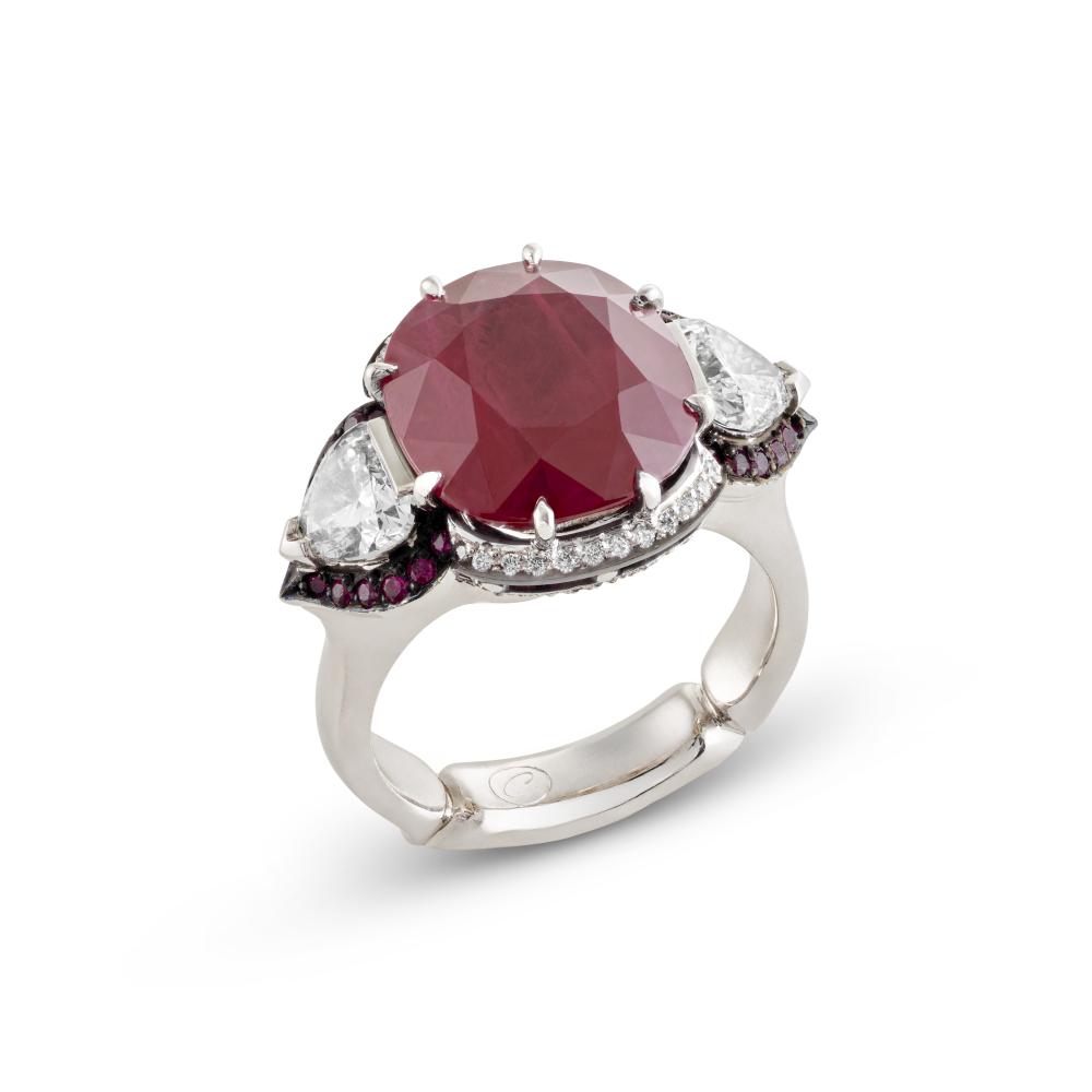 RUBY AND DIAMOND RING

Cushion-shaped and round rubies, trillion-shaped and round diamonds, platinum and 18k white gold; closed-back setting 
SSEF, 2026, report no. 153793: Origin not determinable, indications of heating 
Ruby: for an approximate weight of 8.00 - 9.00 carats 
Diamonds: for an approximate total weight of 1.10 - 1.30 carats 
Size/Dimensions: EU ring size 54 / US ring size 6¹⁄₄ 
Gross weight: 16.5 grams