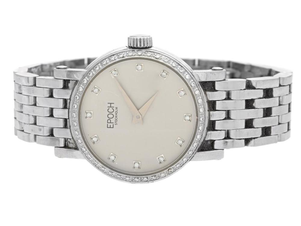 Watches

Epoch

EPOCH, Stockholm, Lady Diamond, ladies´ wristwatch, 28 mm, steel, quartz, sapphire crystal, diamonddial (12 pcs. TW/VVS, approx. 0,12 ctv), brilliantbezel (44 pcs. TW/VVS, approx. 0,22 ctw), original bracelet, folding clasp, Ref no. E07, approx. 2007.